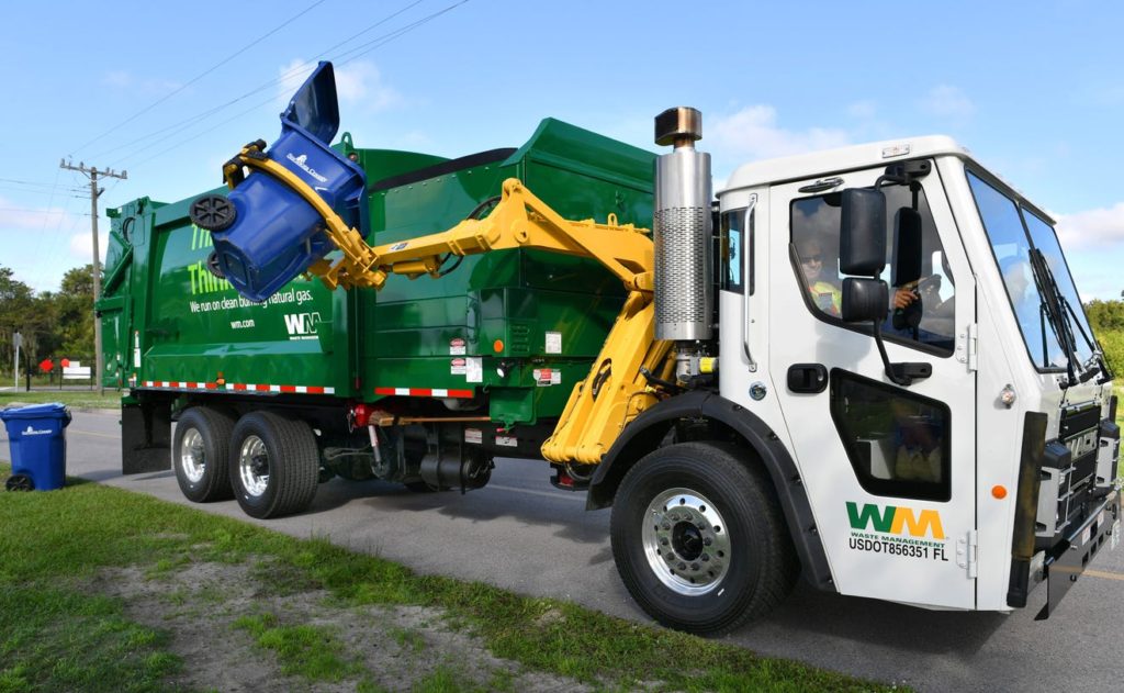 Municipal waste service, photo of grabage truck picking up recyclables.